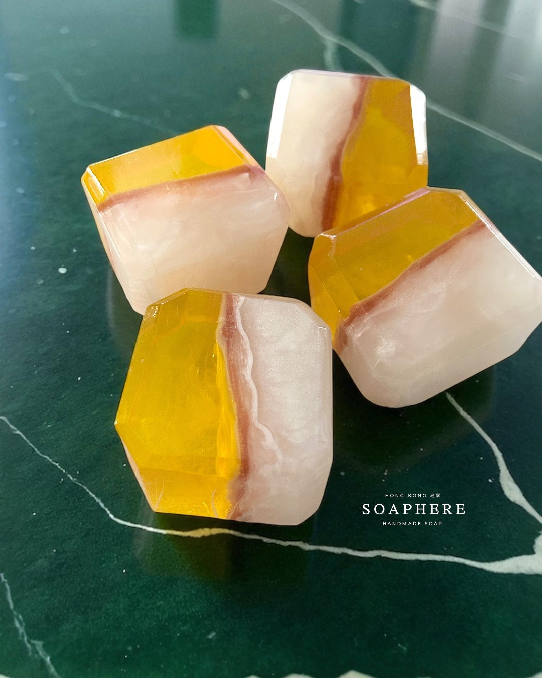 Geometric soap bars with yellow and white design.